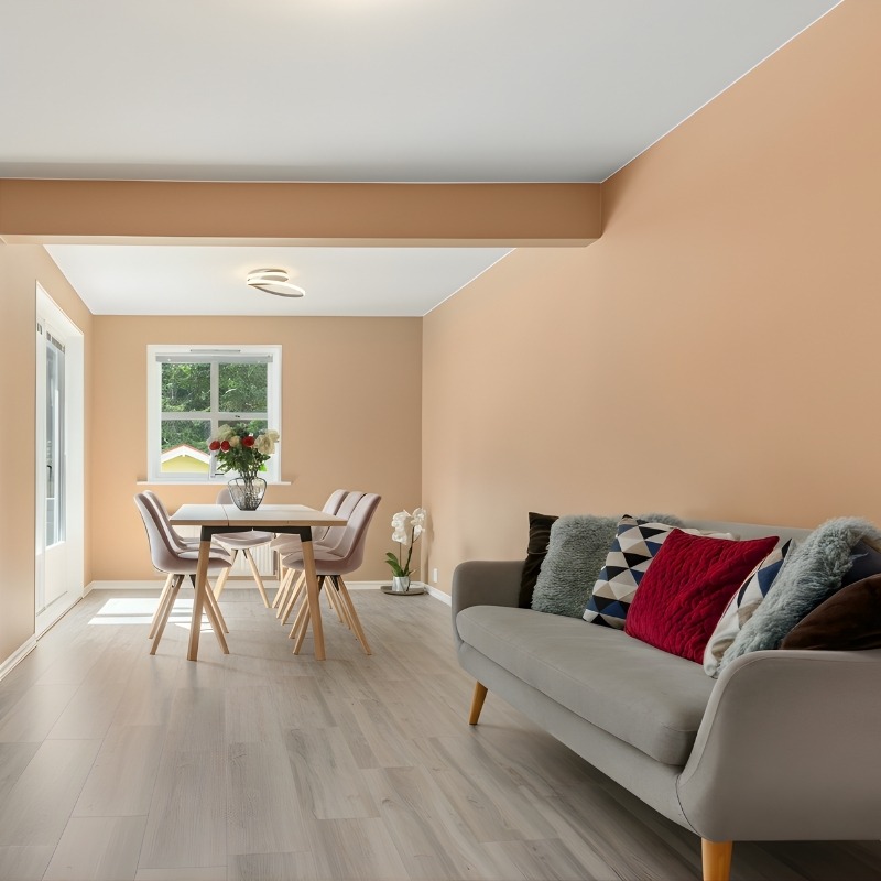 Bright Perth dining and living space with light hybrid flooring, modern décor, and smooth timber-look planks showing the durability and style of hybrid floors.